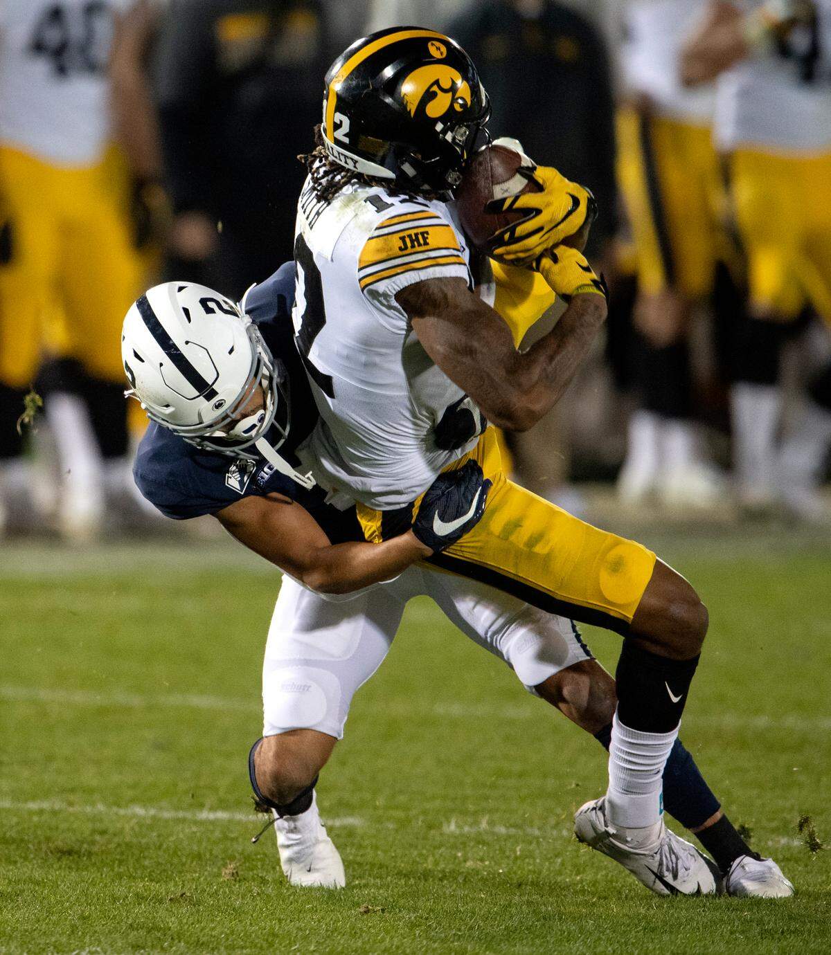 Penn State cornerback Keaton Ellis pulls down Iowa wide receiver Brandon Smith during the game on Saturday, Nov. 21, 2020 at Beaver Stadium.