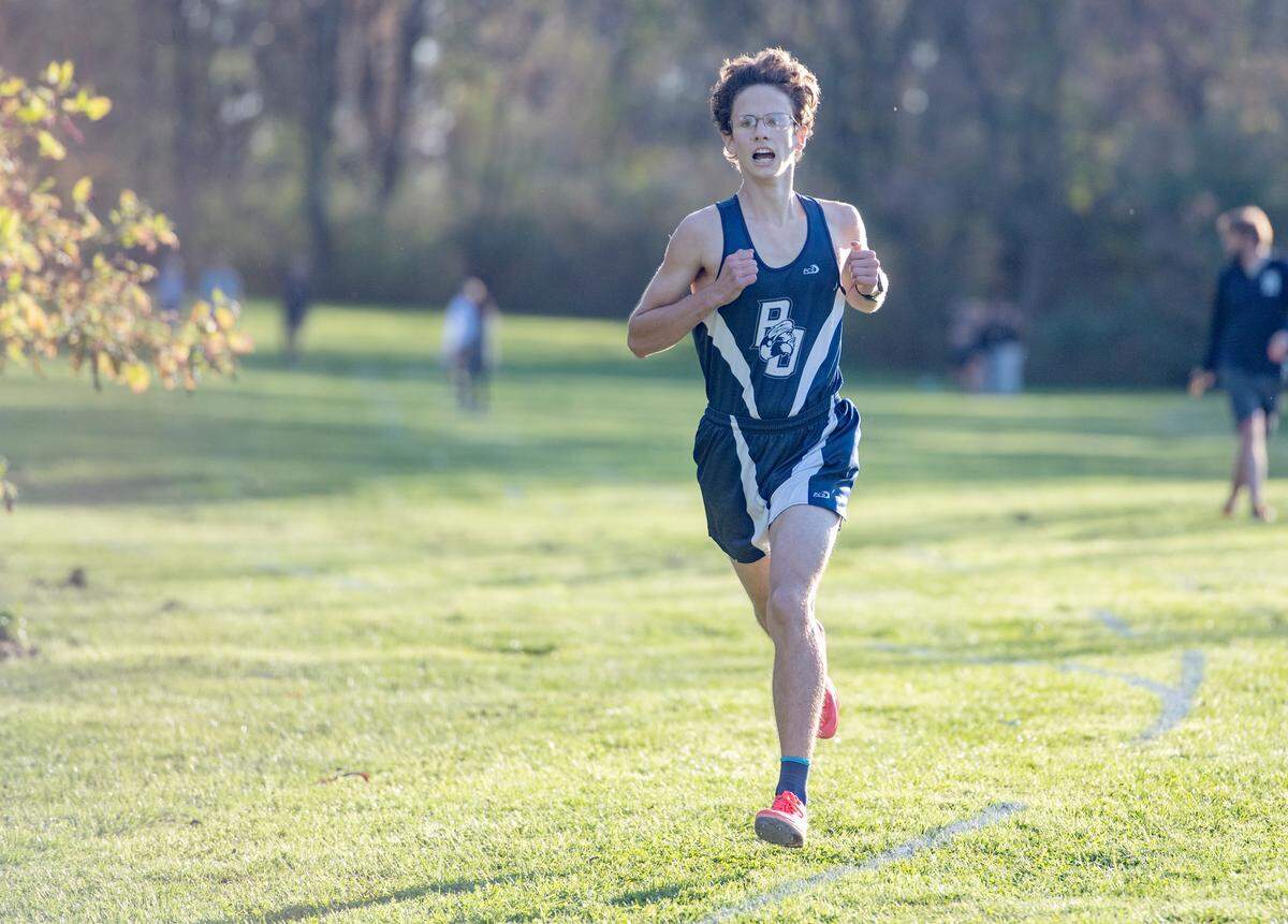 Philipsburg-Osceola’s Chad Muckey sprints to the finish to win the Mountain League cross country championships at Penns Valley on Wednesday, Oct. 20, 2021.