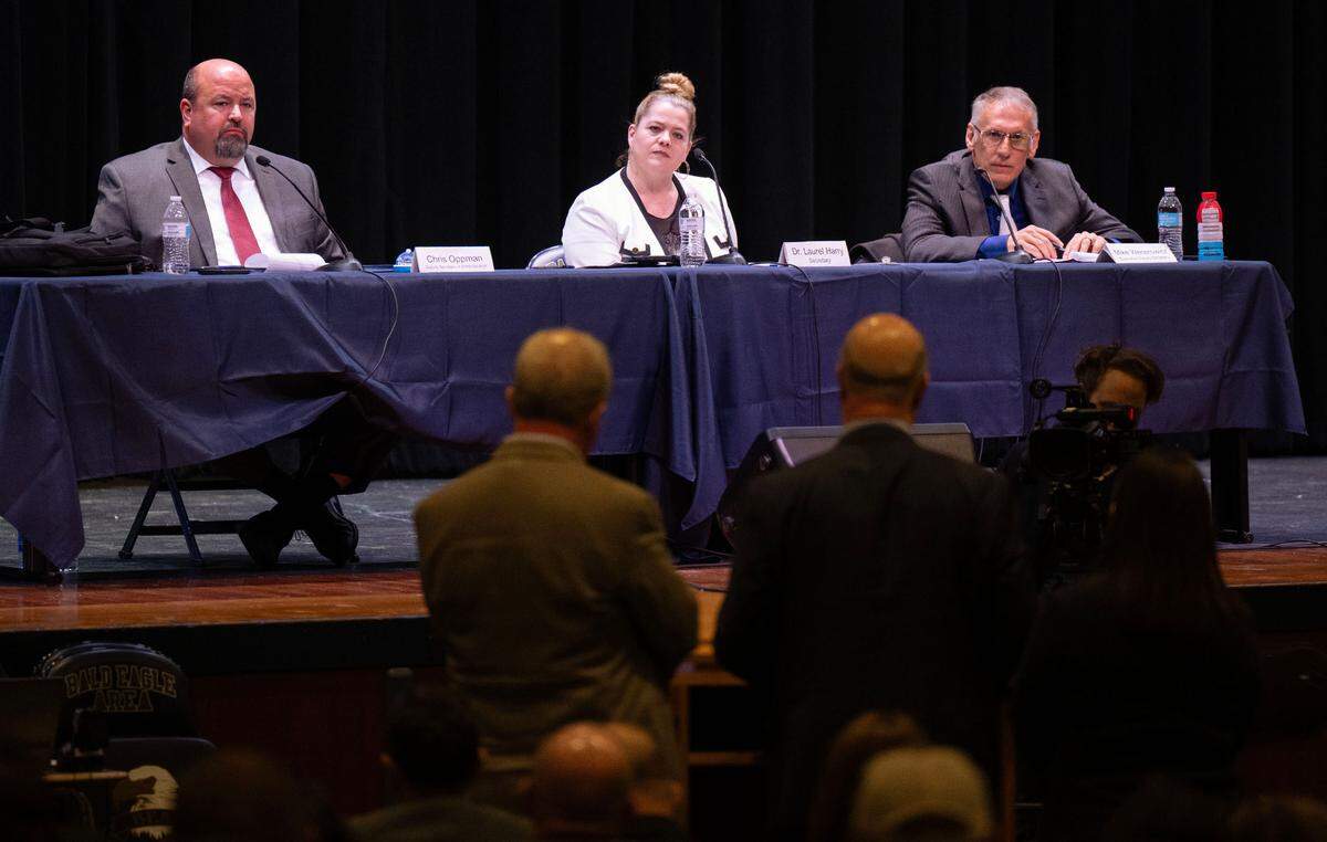 Chris Oppman, deputy security for administration, Laurel Harry, Secretary of Corrections, and Michael Wenerowicz, executive deputy secretary for institutional operations, listen to comments from the Centre County commissioners about Rockview state prison during the Pennsylvania Department of Corrections’ public hearing on the proposed closure of the facility on Tuesday, April 15, 2025 in the auditorium of Bald Eagle Area Middle School and High School.