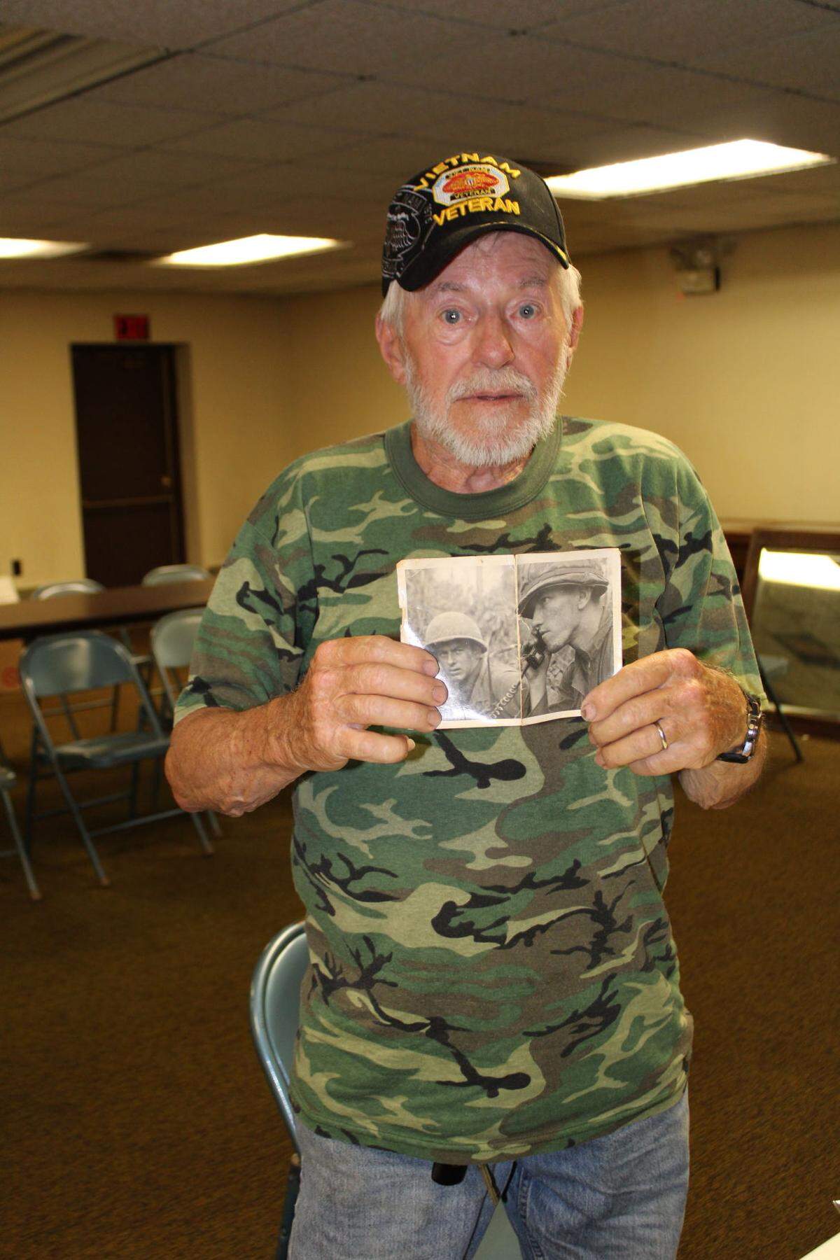 Vietnam veteran Jesse Schweitzer, with a photo of him and an unnamed lieutenant taken in December 1967.