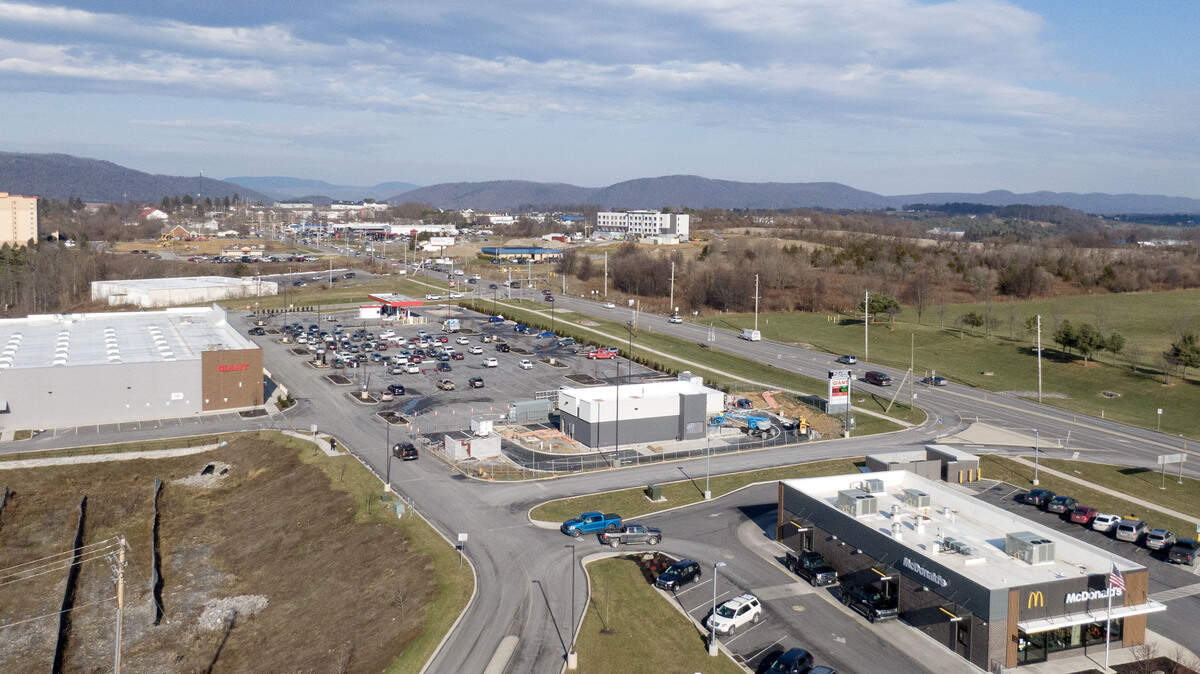 Traffic moves on Benner Pike by the Paradise Shopping Center on Thursday, Dec. 18, 2025.
