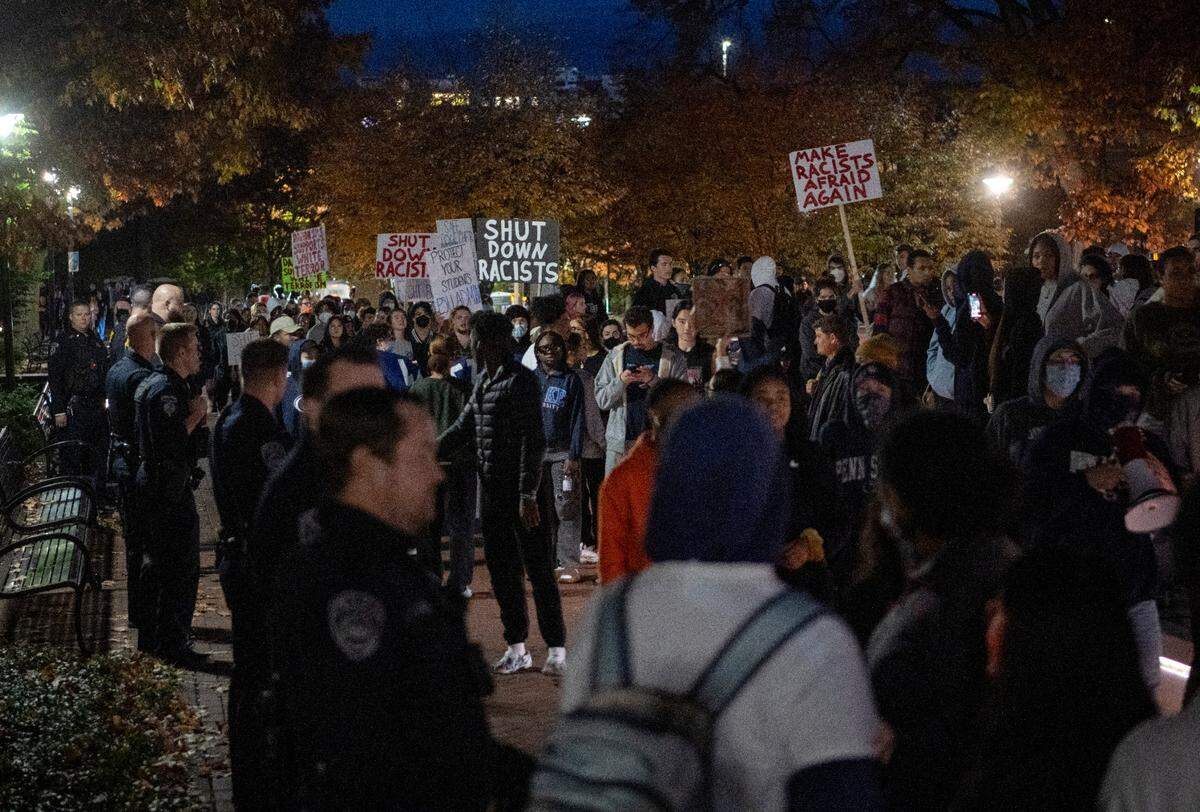 Police line the sidewalk as protesters gather outside of the Thomas Building on Monday, Oct. 24, 2022.