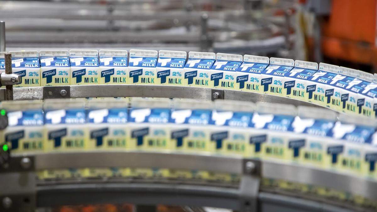 Milk cartons on a production line.