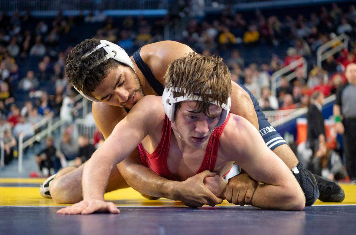 Penn State’s Shayne Van Ness controls Indiana’s Graham Rooks in a 149 lb bout at the Crisler Center on Sunday, March 5, 2023.