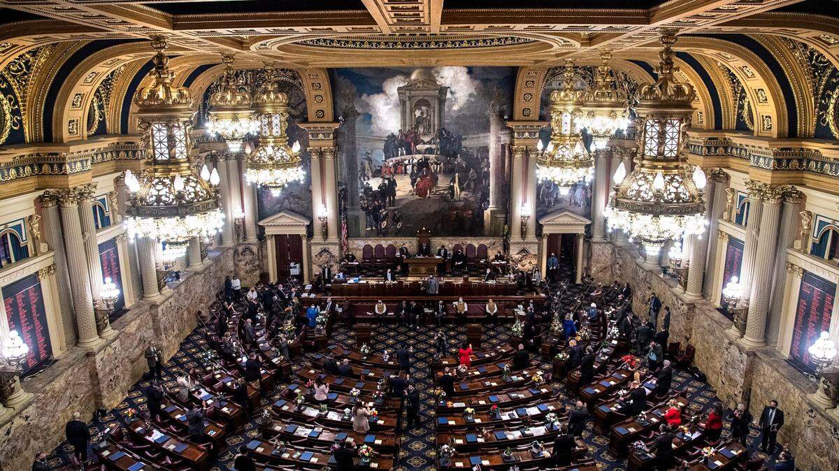 Pennsylvania lawmakers take the oath of office in the House chamber in the Capitol building in Harrisburg in 2021. They will do so again this week.