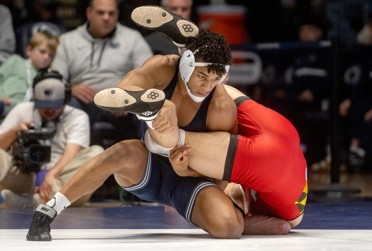 Penn State’s Carter Starocci controls Maryland’s Dominic Solis in the 174 lb bout of the match on Sunday, Feb. 12, 2023 at Rec Hall.