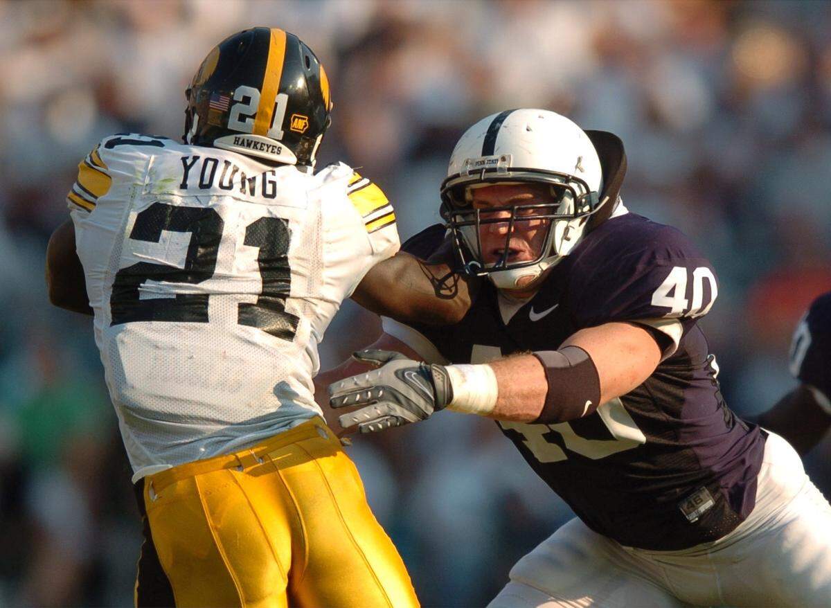 Dan Connor tackles Iowa’s Albert Young on Oct. 6, 2007.