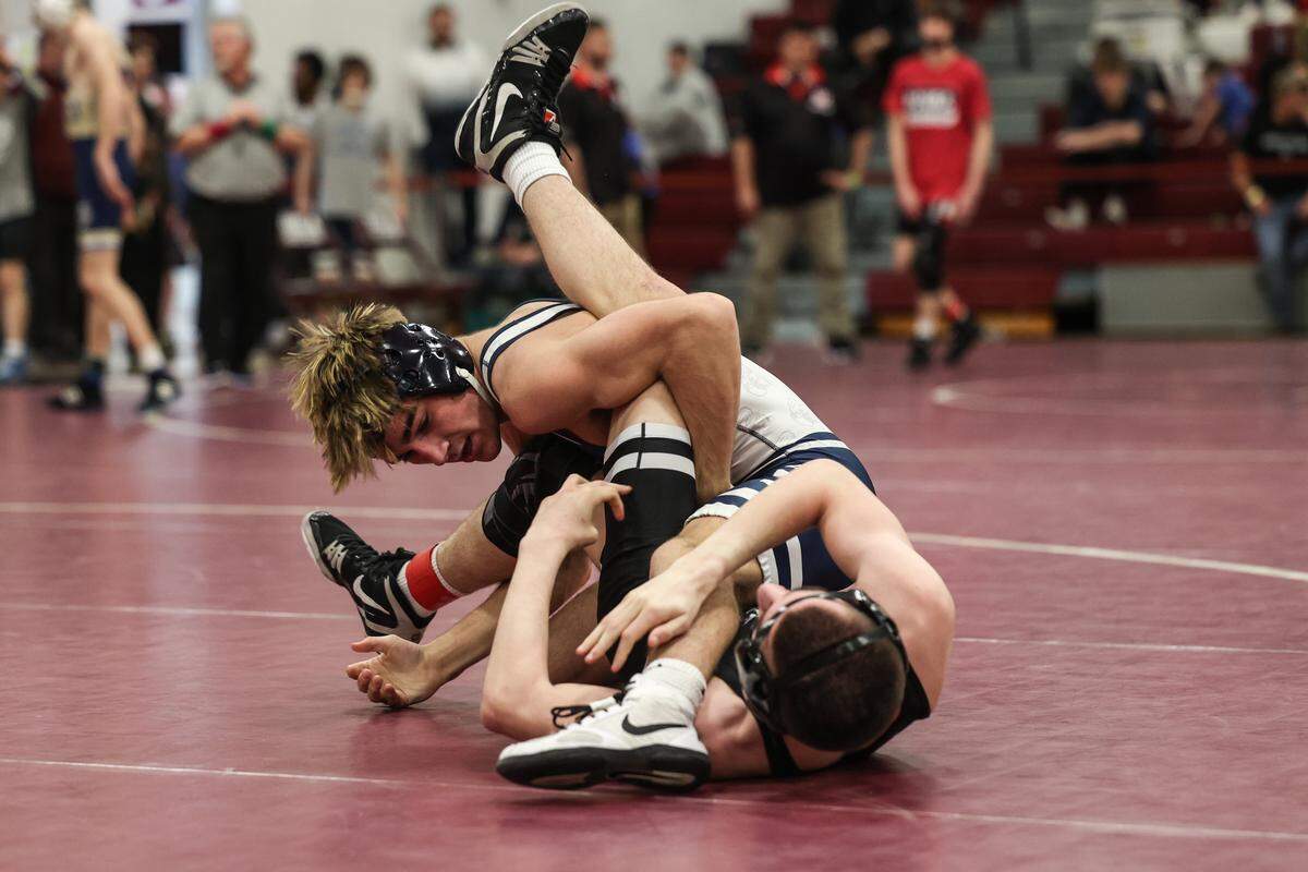 Philipsburg-Osceola’s Caleb Hummel scrambles with Quaker Valley’s Bruce Anderchak in their 121-pound fifth-place match of the PIAA Class 2A Southwest Regional Championships on Saturday, Feb. 28, 2026 in Altoona. Hummel beat Anderchak, 5-2.