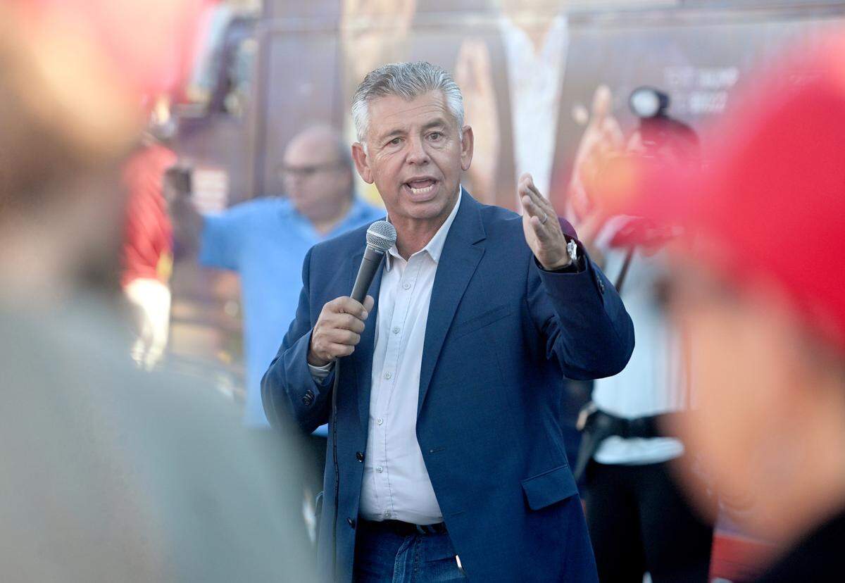 Abel Maldonado, former lieutenant governor of California, speaks to the crowd in a parking lot near Beaver Stadium during a stop of the “Team Trump” bus tour on Tuesday, Oct. 22, 2024.