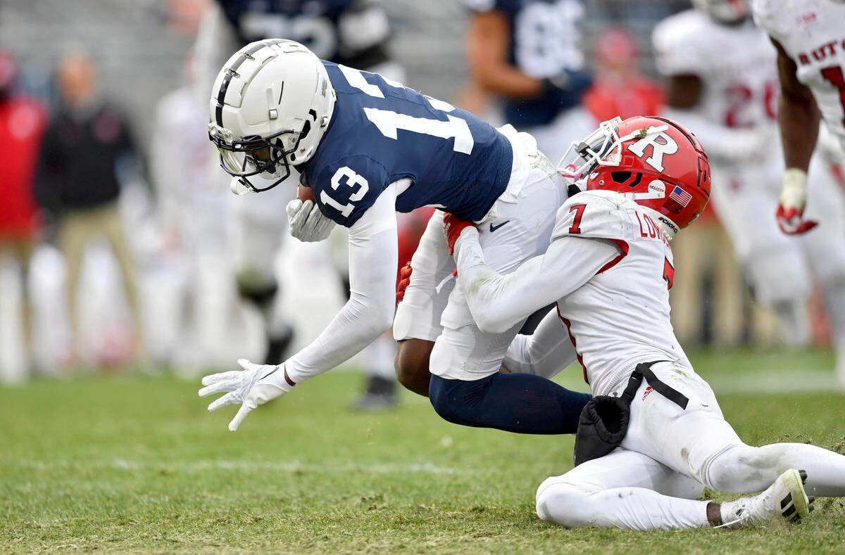 Rutgers defensive back Robert Longerbeam stops Penn State wide receiver KeAndre Lambert-Smith after he makes a catch during the game on Saturday, Nov. 20, 2021.