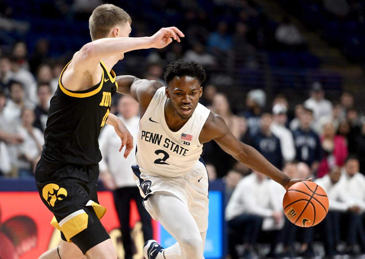 Penn State’s D’Marco Dunn pushes around an Iowa defender during the game on Feb. 8, 2024. Penn State won, 89-79.
