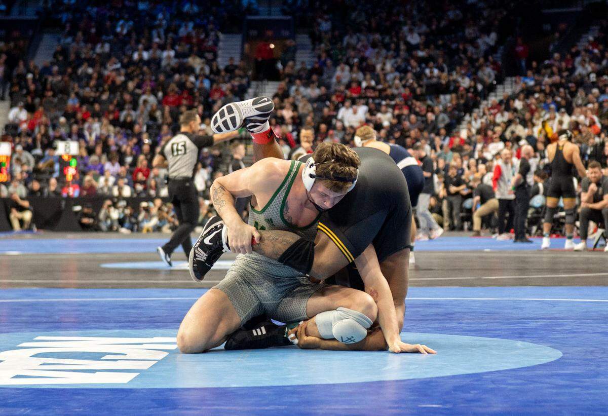 George Mason’s Malachi DuVall faces Iowa’s Gabe Arnold in the 184-pound bout during the 2025 NCAA Wrestling Championships in Philadelphia on Friday, March 21, 2025.