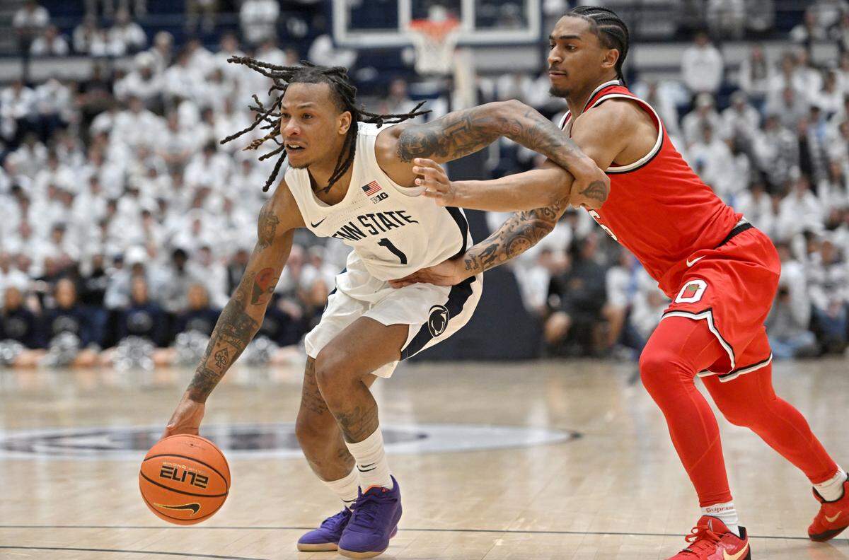 Penn State’s Ace Baldwin Jr. dribbles down the court around an Ohio State’s defender during game on Thursday, Jan. 30, 2025 at Rec Hall.