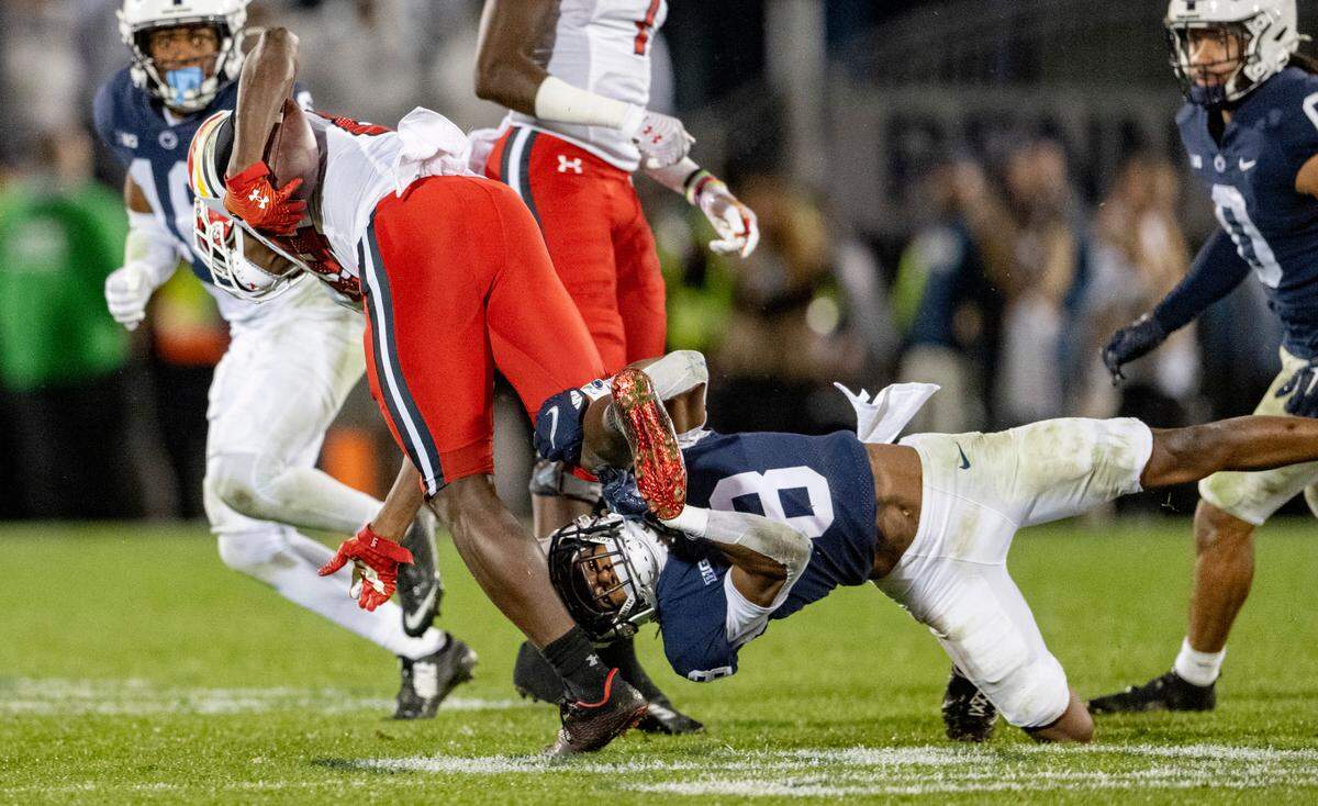 Penn State’s Marquis Wilson trips up Maryland’s ball carrier during the game on Saturday, Nov. 12, 2022.