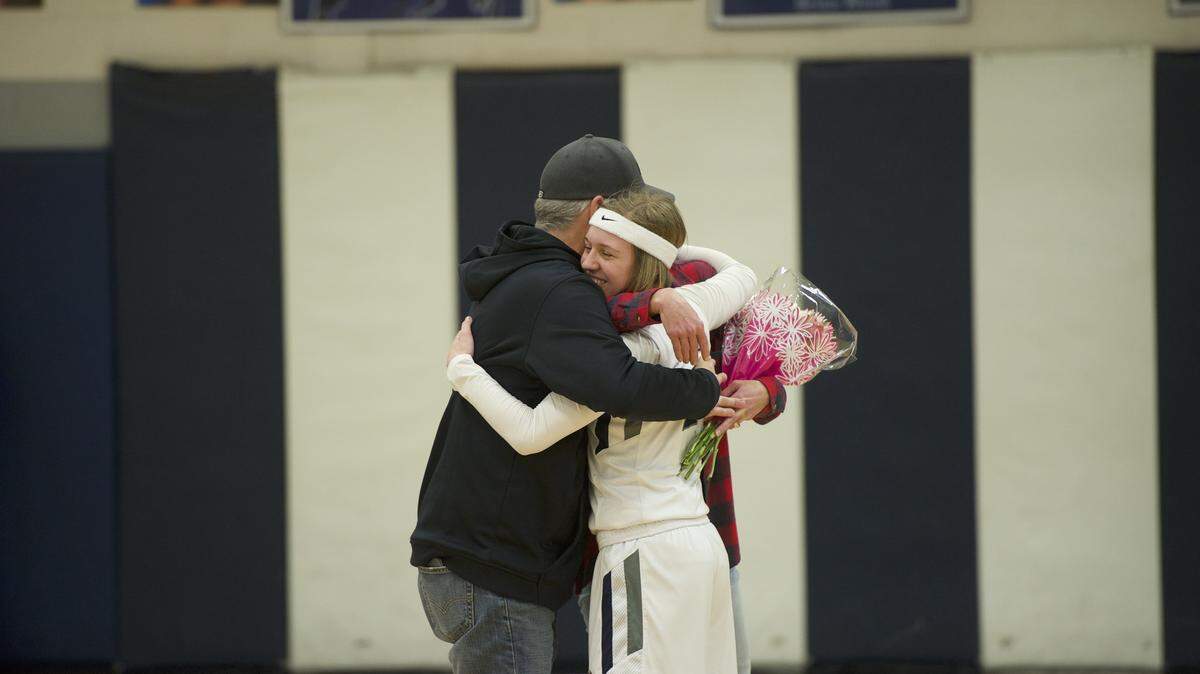Philipsburg-Osceola guard Halle Herrington hugs her parents after setting the Centre County scoring record on Friday, February 8, 2019 at Philipsburg. Herrington needed 14 points to surpass Penns Valley grad Dana McDonald and scored 29 in P-O’s 81-50 loss.