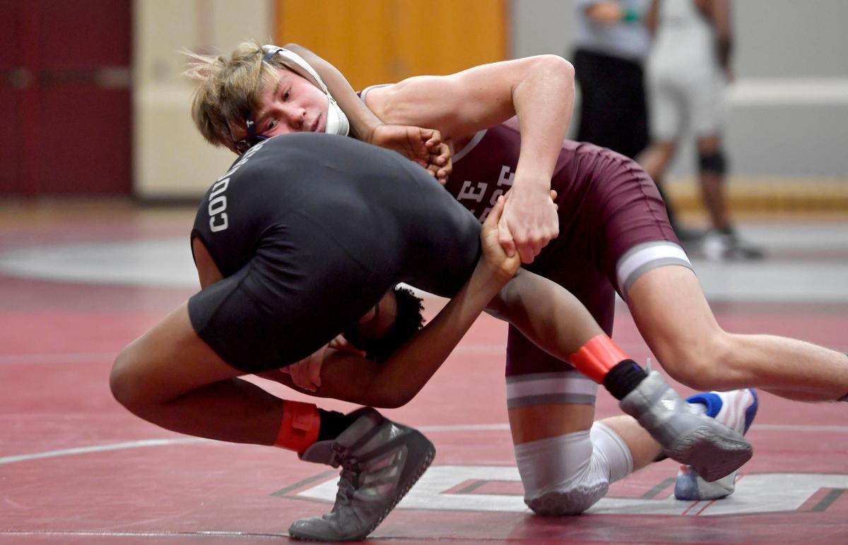 State College’s Eric Weaver flips Harrisburg’s Skyblu Brunelle in the 120 lb bout during the match on Tuesday, Dec. 17, 2019. Wevaer won by fall in 25 seconds.