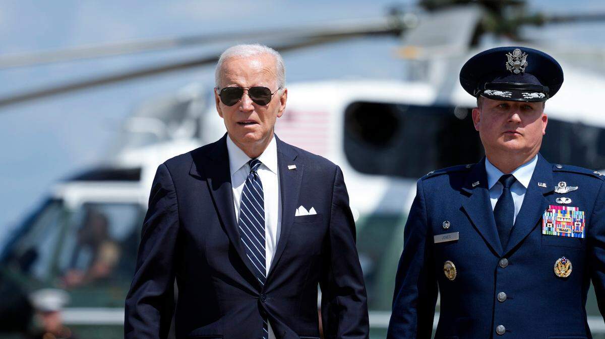 President Joe Biden, escorted by Col. Matthew E. Jones, Commander of the 89th Airlift Wing, walks to board Air Force One, Thursday, Aug. 17, 2023, at Andrews Air Force Base, Md. Biden is headed to Pennsylvania. (AP Photo/Alex Brandon)