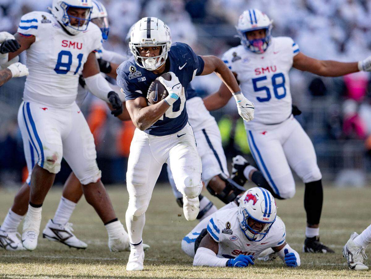 Penn State running back Nick Singleton cuts down the field with the ball from SMU defenders during the game on Saturday, Dec. 21, 2024 at Beaver Stadium.