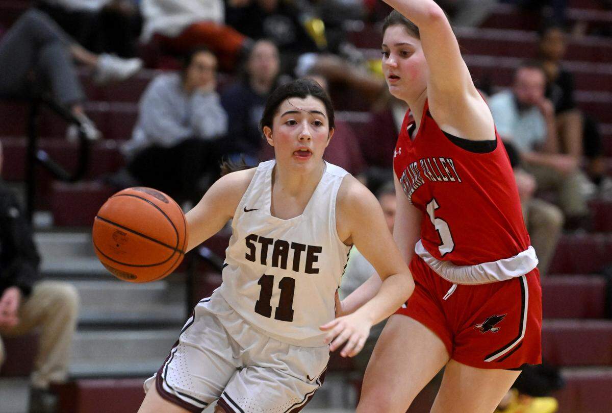 State College’s Carley Donnell dribbles around Cumberland Valley’s Ashley Berkheimer during the game on Tuesday, Jan, 24, 2023.