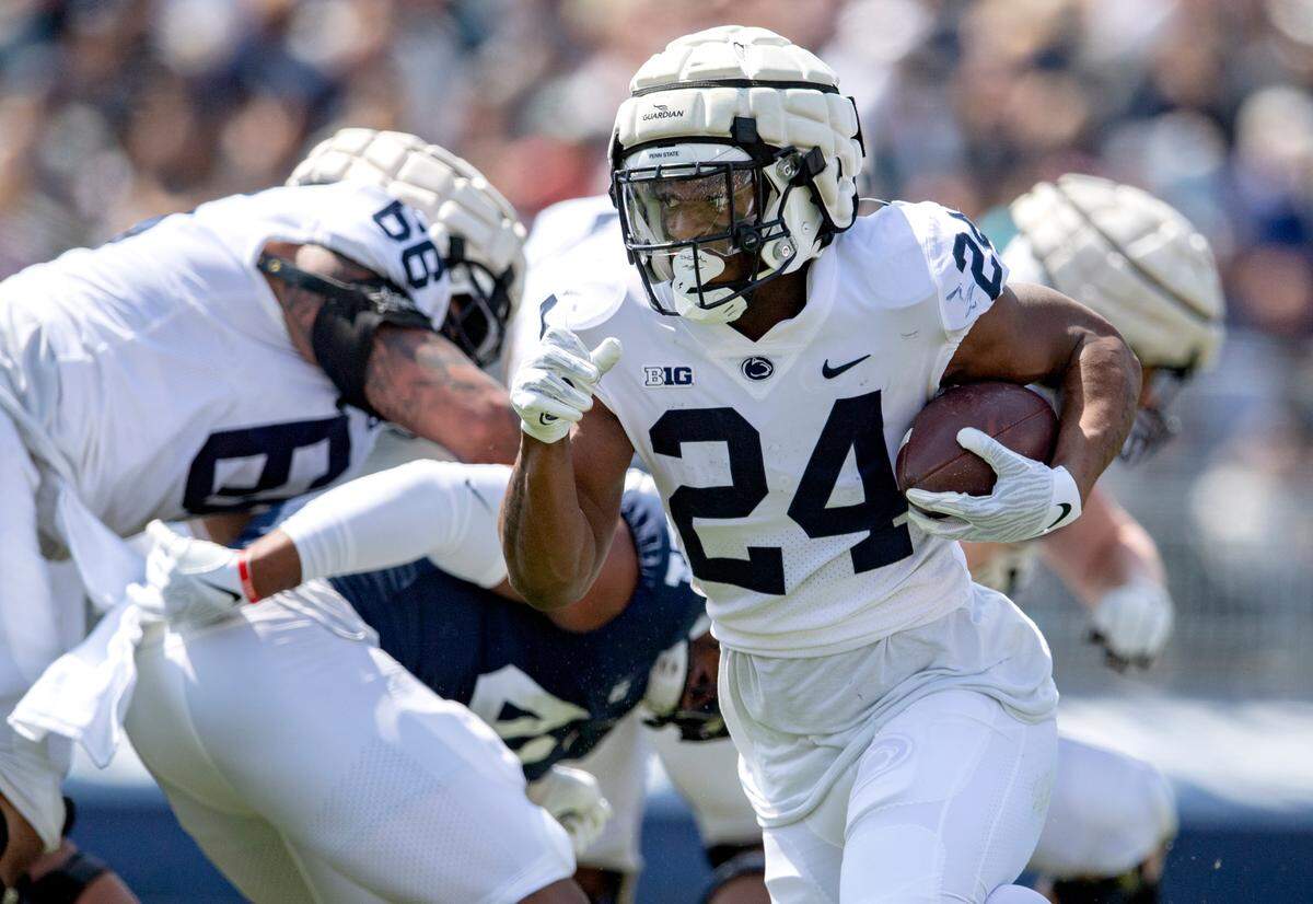 Penn State running back Keyvone Lee cuts down the field with the ball during the Blue-White game on Saturday, April 23, 2022.