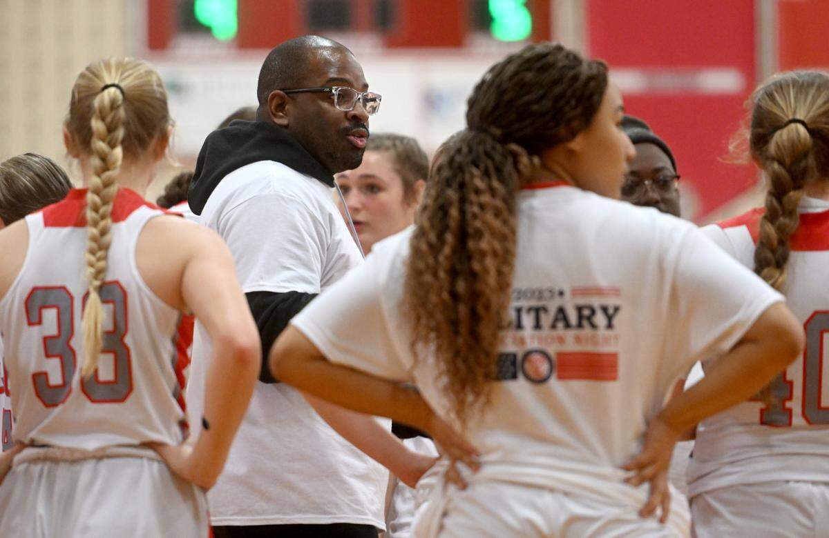 Bellefonte girls basketball coach Marcus Toomer talks to his team during a timeout of the game against Penns Valley on Monday, Jan. 23, 2023.