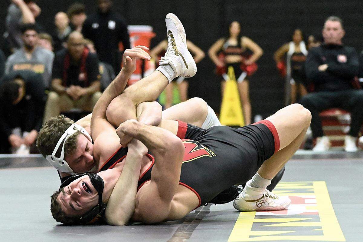Penn State’s Bernie Truax aims to pin Maryland’s Chase Mielnik in their 184-pound bout of the Nittany Lions’ 42-6 on Jan. 28. Truax did pin Mielnik in 1:43