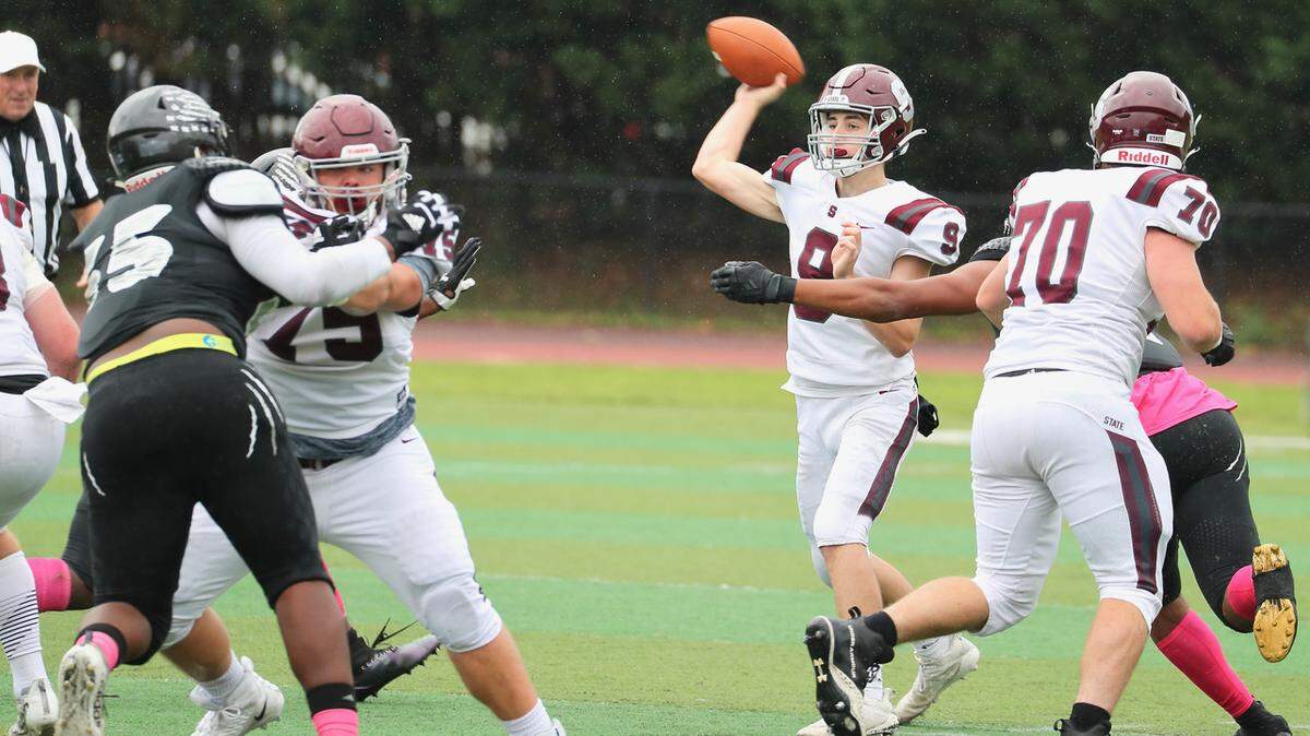 State College’s Owen Yerka looks to make a pass against Harrisburg on Saturday, Oct. 23, 2021. State College lost 15-13.