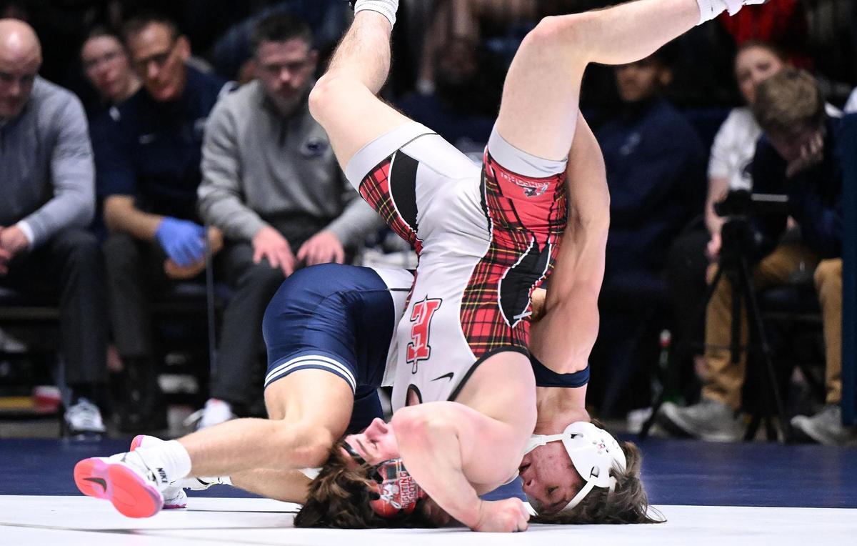Penn State’s Tyler Kasak upends Edinboro’s Colin Roberts at 149 pounds during Sunday’s final home wrestling meet at Rec Hall in University Park. Kasak went on to defeat Roberts by pin. Penn State defeated Edinboro, 55-0.