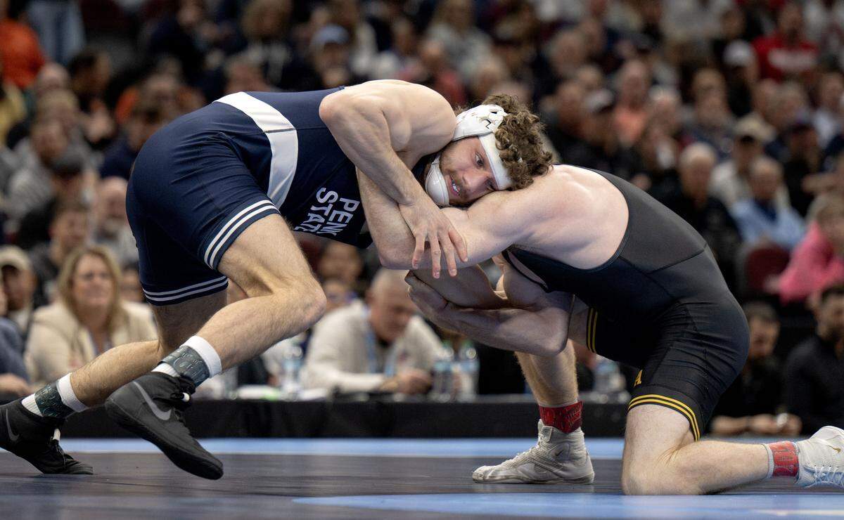 Penn State's Mitchell Mesenbrink controls Iowa’s Michael Caliendo in the 165-pound championship bout at the NCAA wrestling championships on Saturday, March 21, 2026.