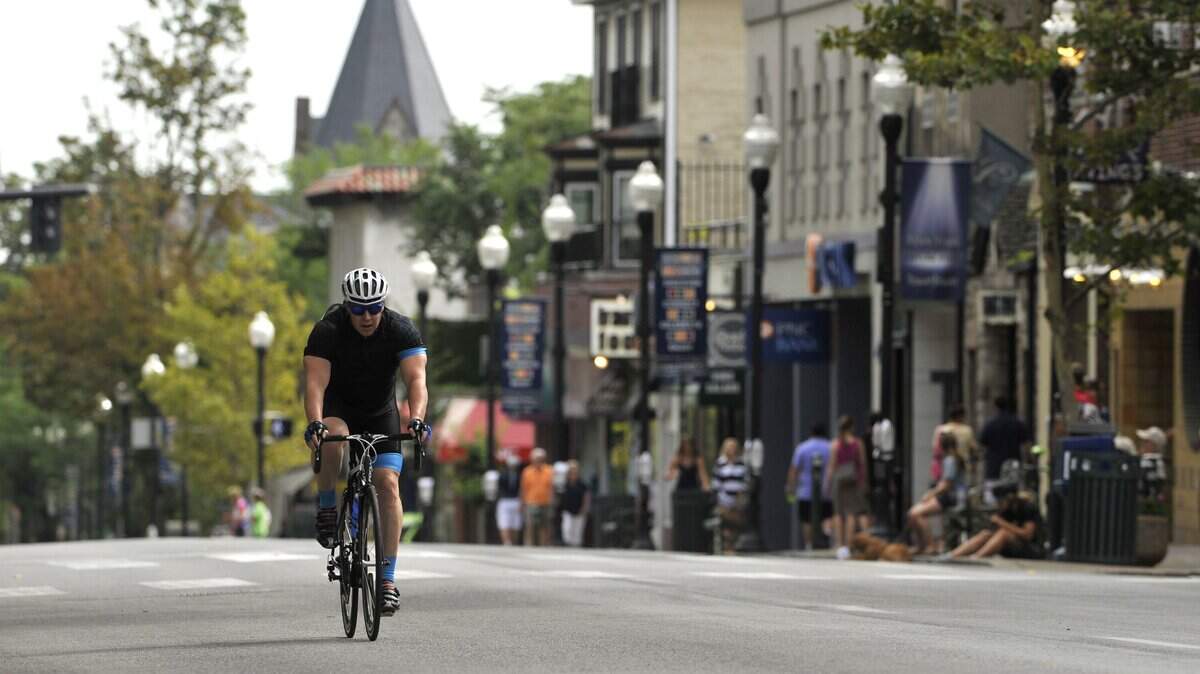 Larry Garvin rides along College Avenue in State College during the Nittany Stage Race time trial in 2015.  State College received a score of 57 in the AARP's most recent Livability Index, updated Thursday.