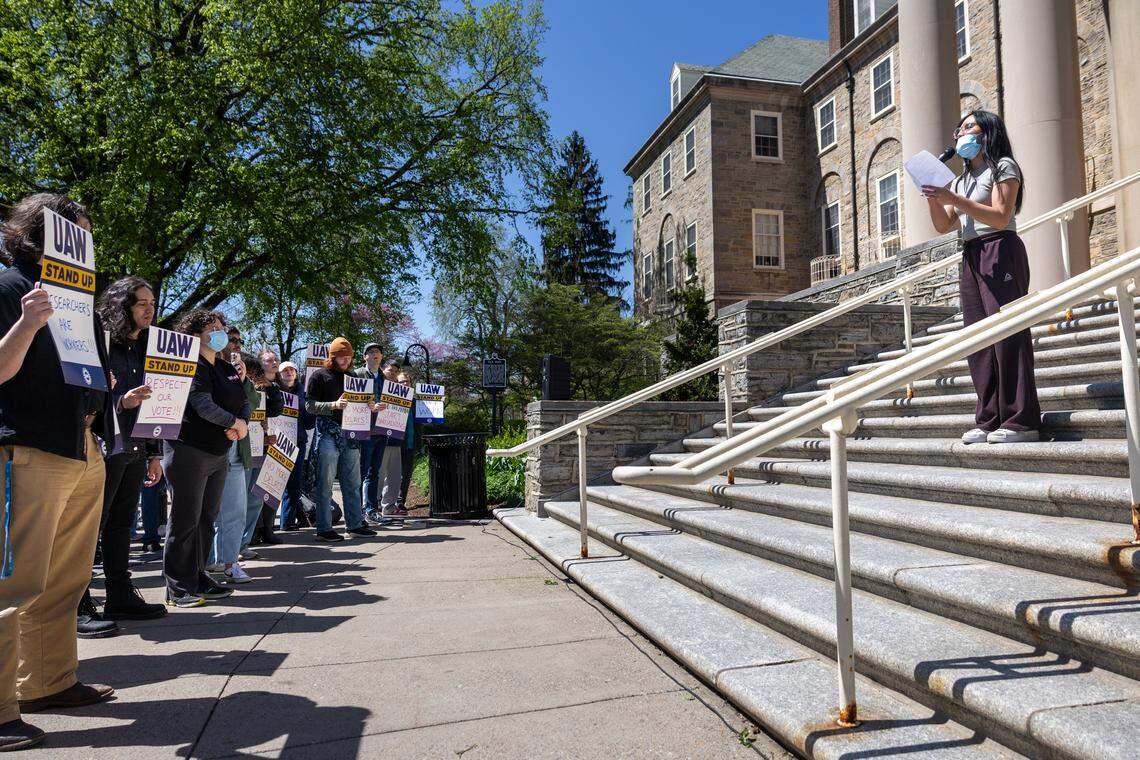 Aflah Hanafiah, a Ph.D. student in biomedical sciences, speaks to the crowd in front of Old Main on Tuesday, April 21, 2026. 