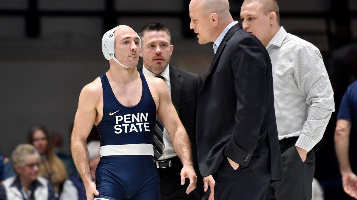 Penn State wrestling coach Cael Sanderson talks to Jarod Verkleeren during a challenge in his 149 lb bout of the match on Friday, Jan. 10, 2020 in Rec Hall. Verkleeren won by decision, 6-2.