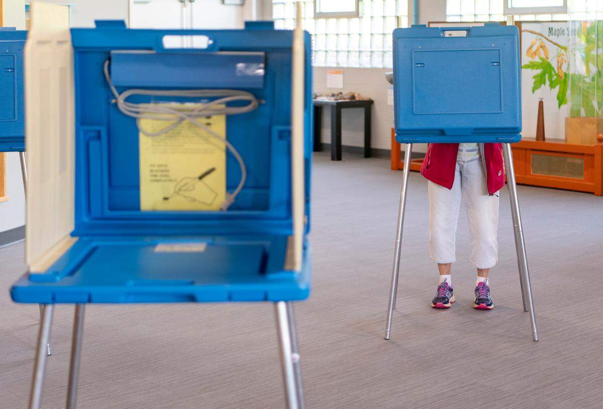 Ferguson Township residents vote in Tuesday’s primary at a polling place at Discovery Space.