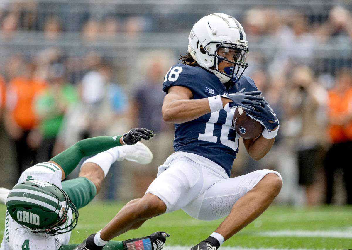 Penn State wide receiver Omari Evans makes a catch in the end zone for a touchdown around an Ohio defender during the game on Saturday, Sept. 10, 2022.