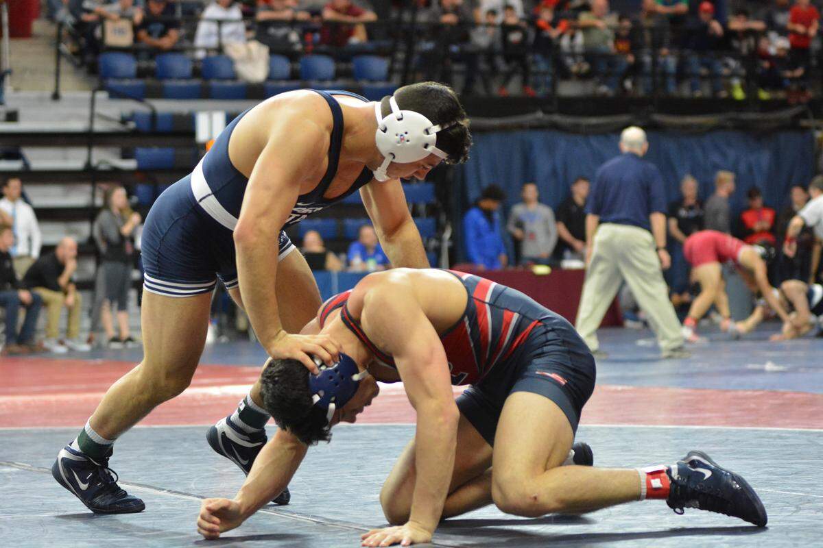 Penn State’s Vincenzo Joseph, left, looks to keep the University of Pennsylvania’s Evan Deluise from his legs during their 165-pound quarterfinal match during the Keystone Classic on Sunday. Joseph pinned Deluise in 4:29.