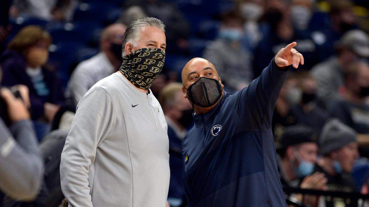 Penn State coach Micah Shrewsberry, right, welcomes Purdue coach Matt Painter to the Bryce Jordan Center before the start of their NCAA college basketball game Saturday, Jan. 8, 2022, in State College.