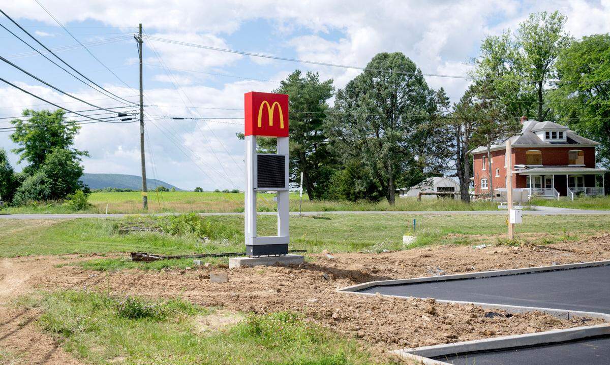An abandoned house on Paradise Road, across the street from where a McDonald’s is being built, is the potential site for an Arby’s.