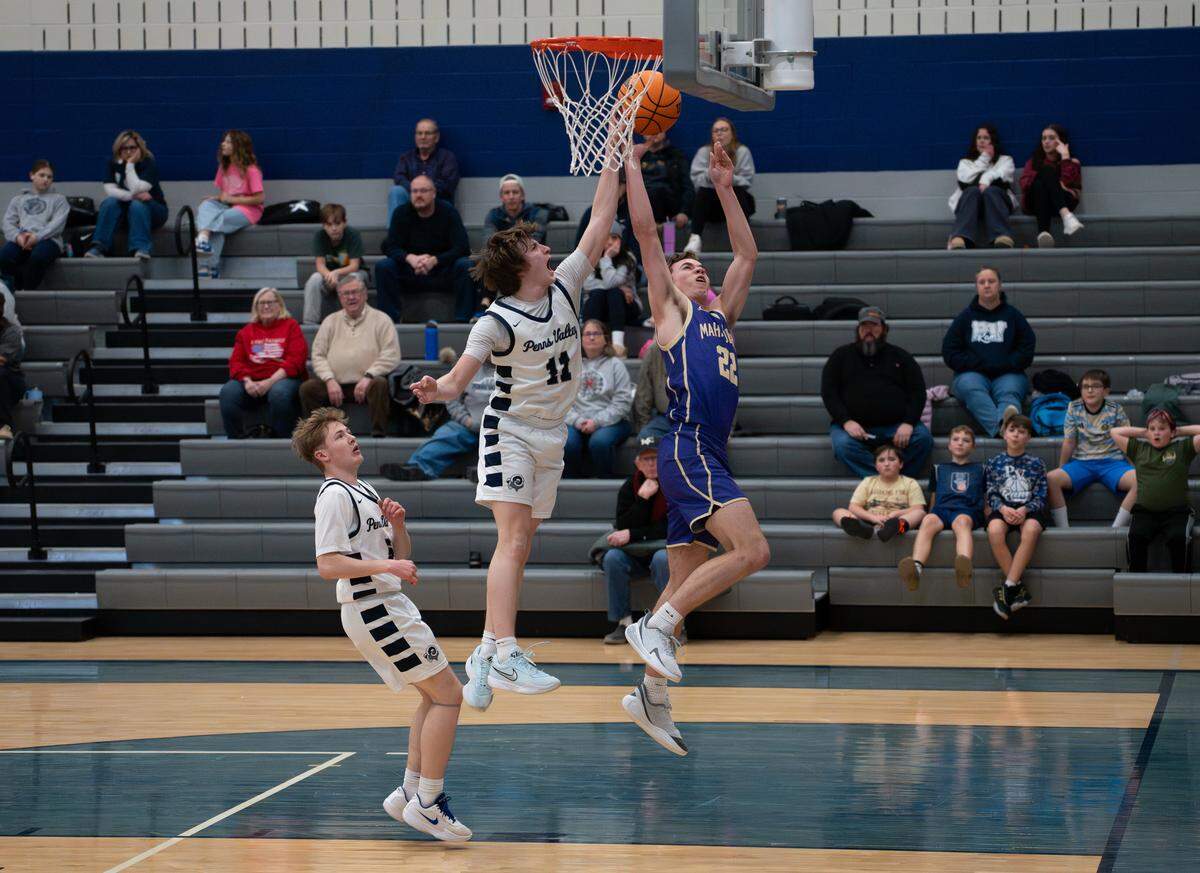 Penns Valley’s Fletcher Ironside (11) blocks a shot by Bishop Guilfoyle’s Damon Misiura (22) during the boys basketball game at Penns Valley Area High School on Friday, Jan. 23, 2026, in Spring Mills, Pa. The Marauders defeated the Rams 66-41.
