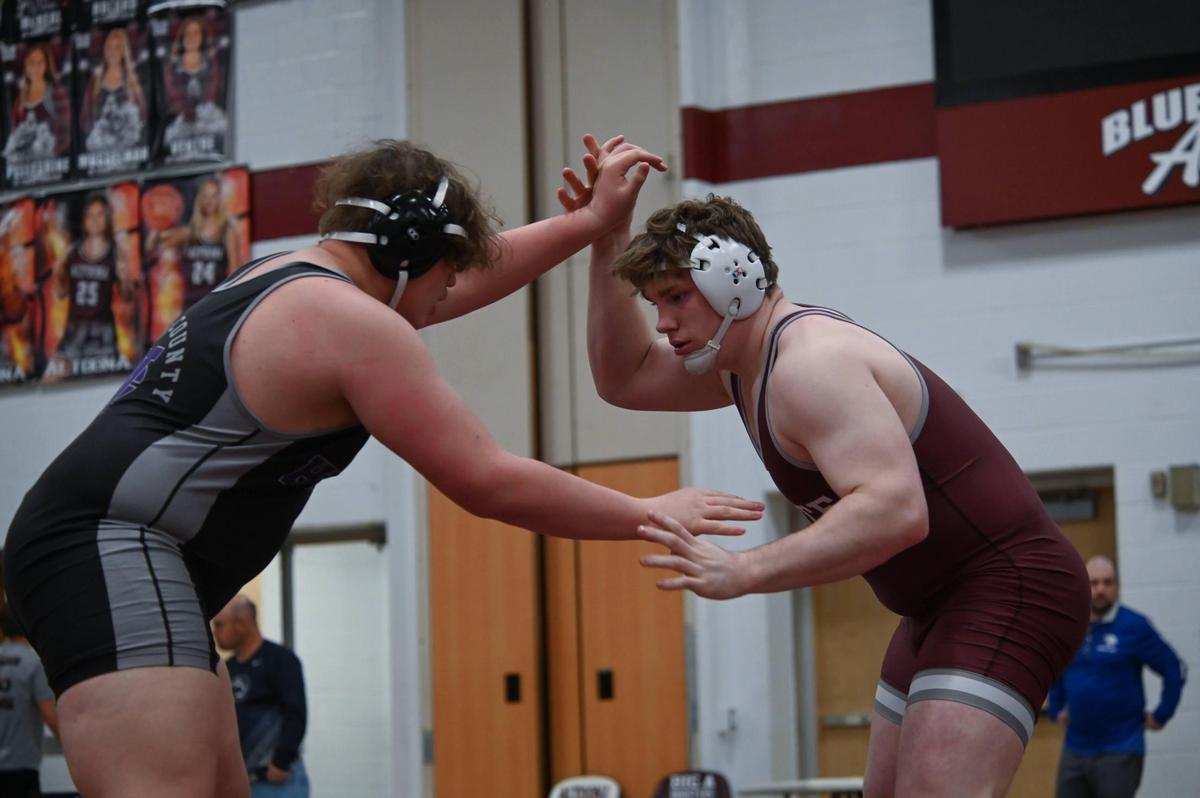 State College’s Nick Pavlechko looks for an opening on Mifflin County’s Peyton Kearns in their 285-pound finals match of the PIAA Class 3A Northwest Regional Championships on Saturday, Feb. 25, 2023 in Altoona. Pavlechko pinned Kearns in 1:56.
