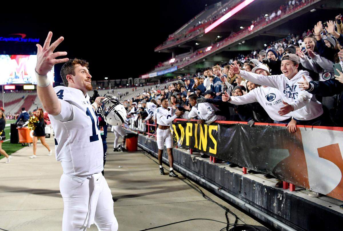 Penn State fans cheer as quarterback Sean Clifford celebrates the 31-14 win over Maryland Saturday, Nov. 6, 2021.