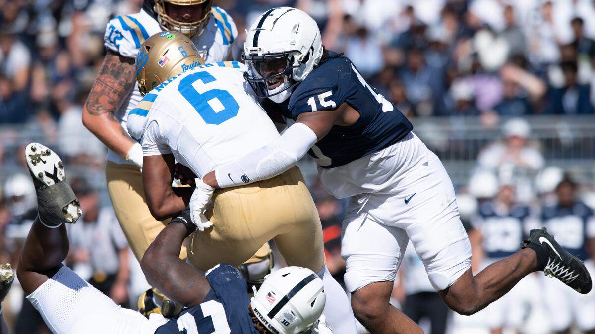 Penn State defensive end Amin Vanover (15) and defensive tackle Zane Durant combine to sack UCLA quarterback Justyn Martin during the football game at Beaver Stadium on Oct. 5, 2024. The Nittany Lions beat the Bruins 27-11.