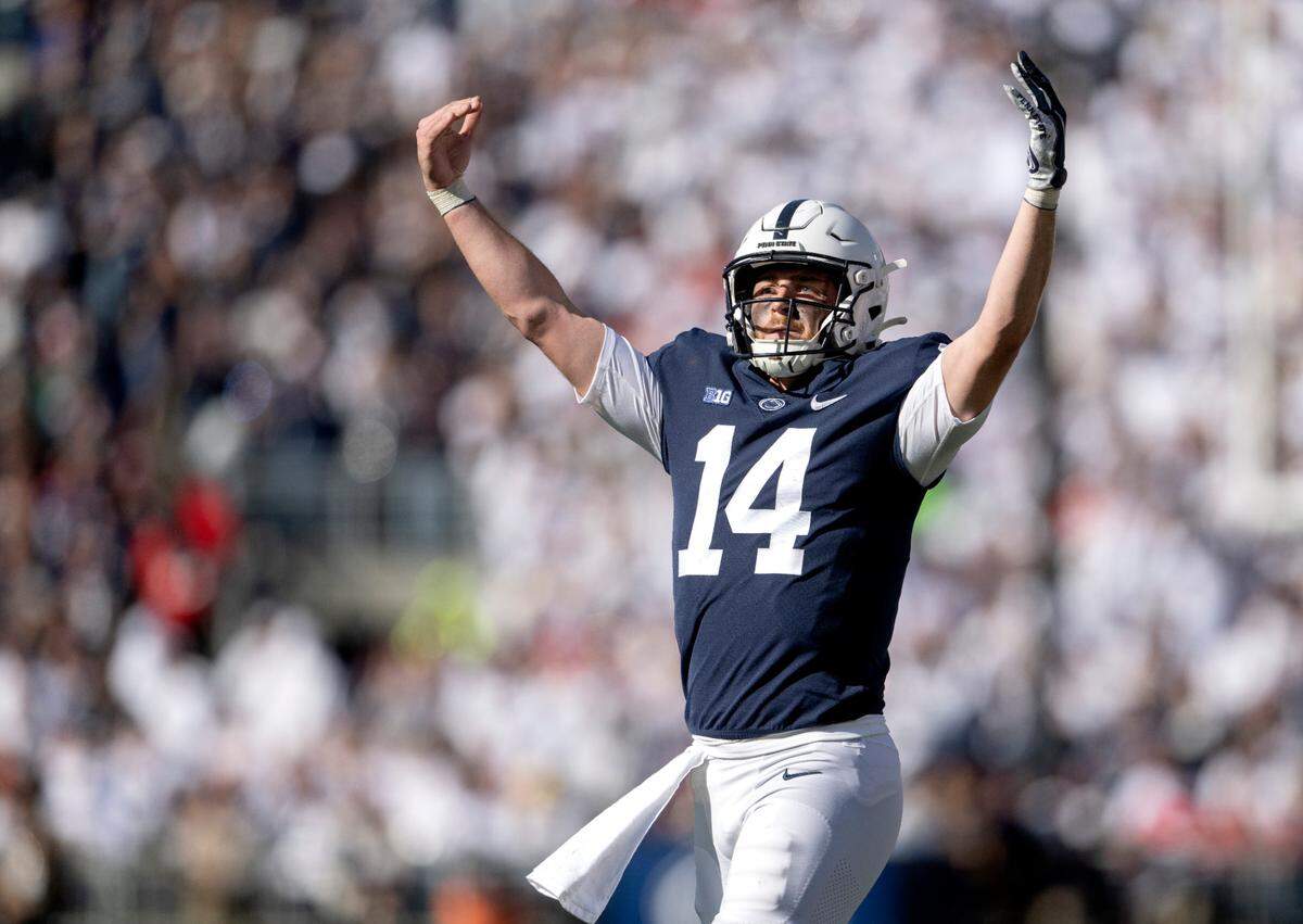 Penn State quarterback Sean Clifford pumps up the crowd after a touchdown during the game against Ohio State on Saturday, Oct. 29, 2022.