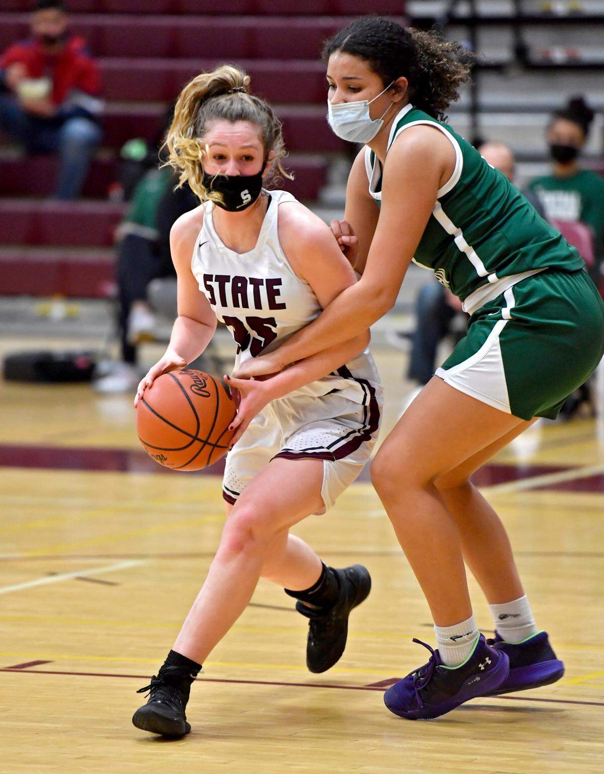 State College’s Megan Lieb pushes around a Central Dauphin defender during the game on Wednesday, Feb. 24, 2021.