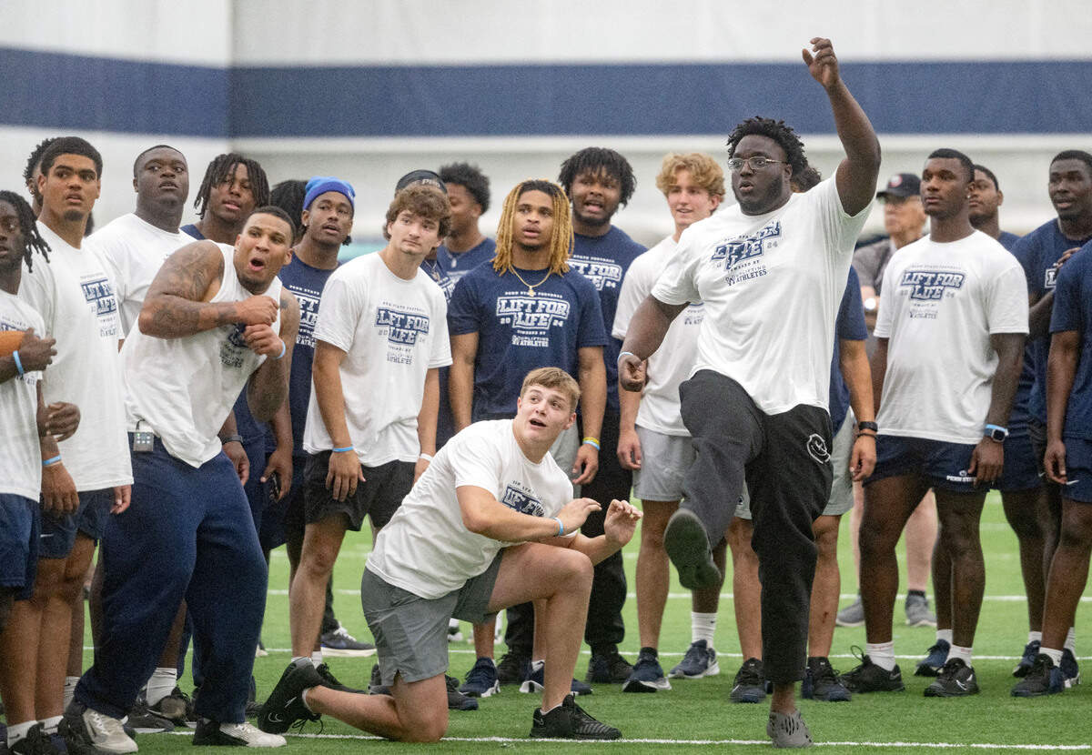 Teammates react as offensive lineman JB Nelson tries to kick a field goal during Penn State football’s 21st Annual Lift for Life to benefit Uplifting Athletes on Thursday, June 13, 2024 in Holuba Hall.