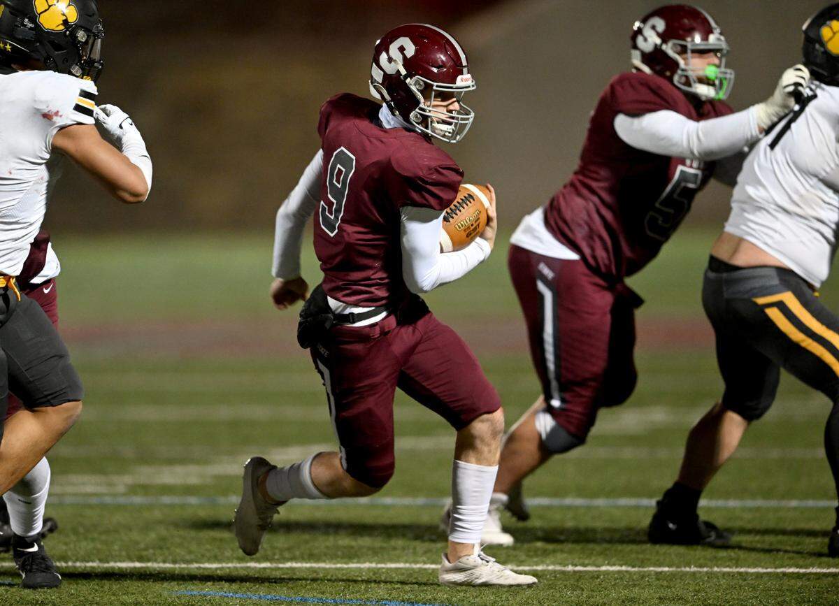 State College’s Owen Yerka cuts around North Allegheny defenders for a touchdown during the PIAA class 6A quarterfinals game on Friday, Nov. 25, 2022 at Memorial Field.