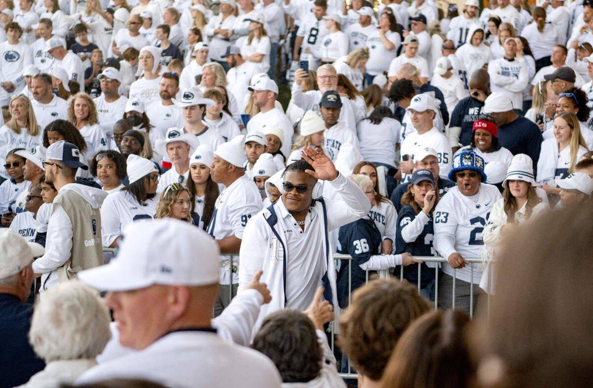 Penn State safety Ji’Ayir Brown waves to fans as he and the team arrive at Beaver Stadium for the game against Minnesota on Saturday, Oct. 22, 2022.