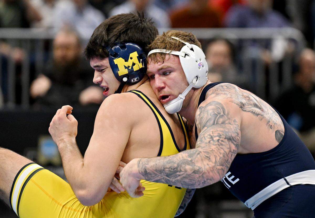 Penn State's Rocco Welsh controls Michigan’s Brock Mantanona in a 184-pound semifinal bout of the NCAA wrestling championships on Friday, March 20, 2026.