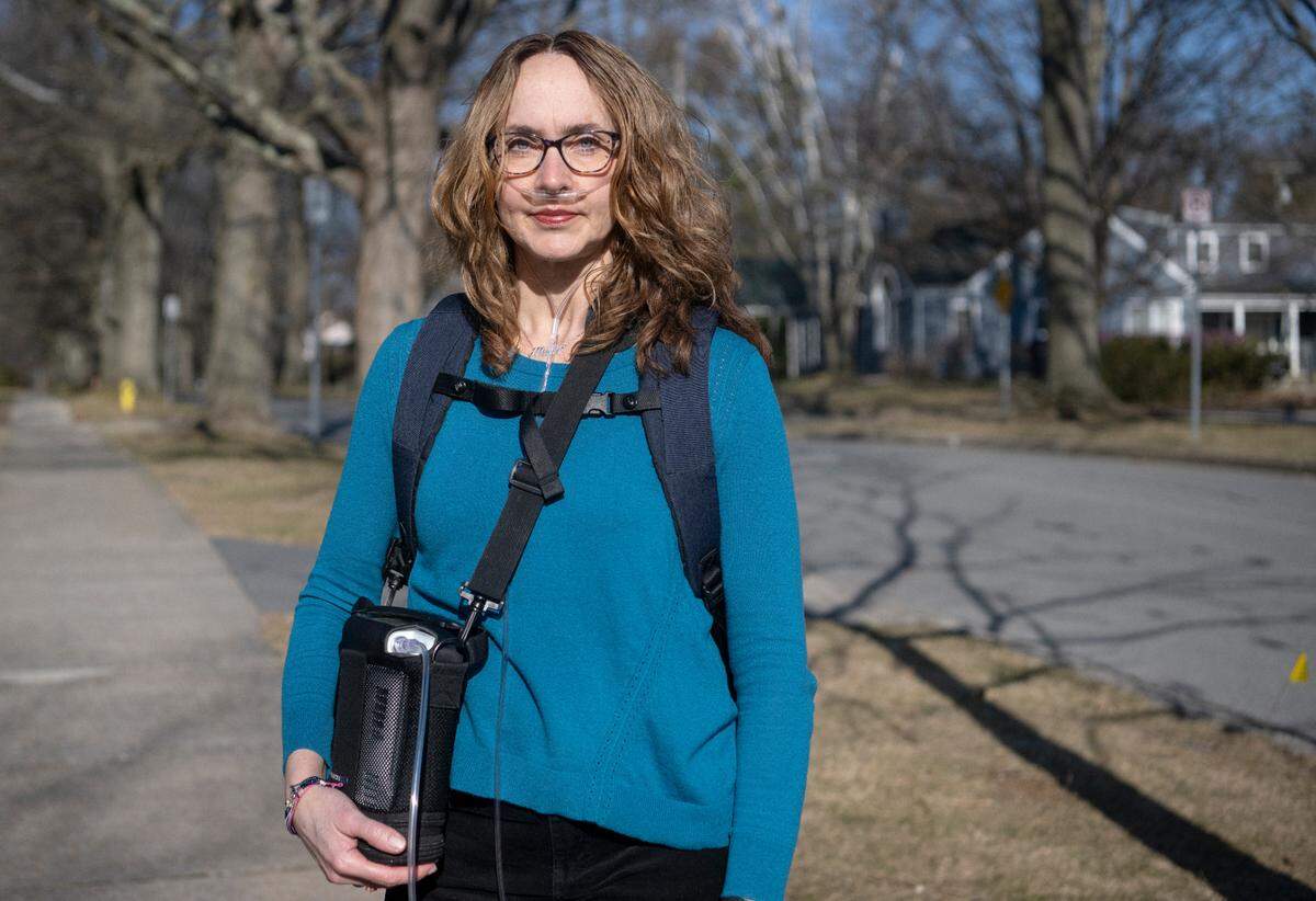 Esther Prins, a Penn State professor, has to use oxygen to walk to campus after health issues.