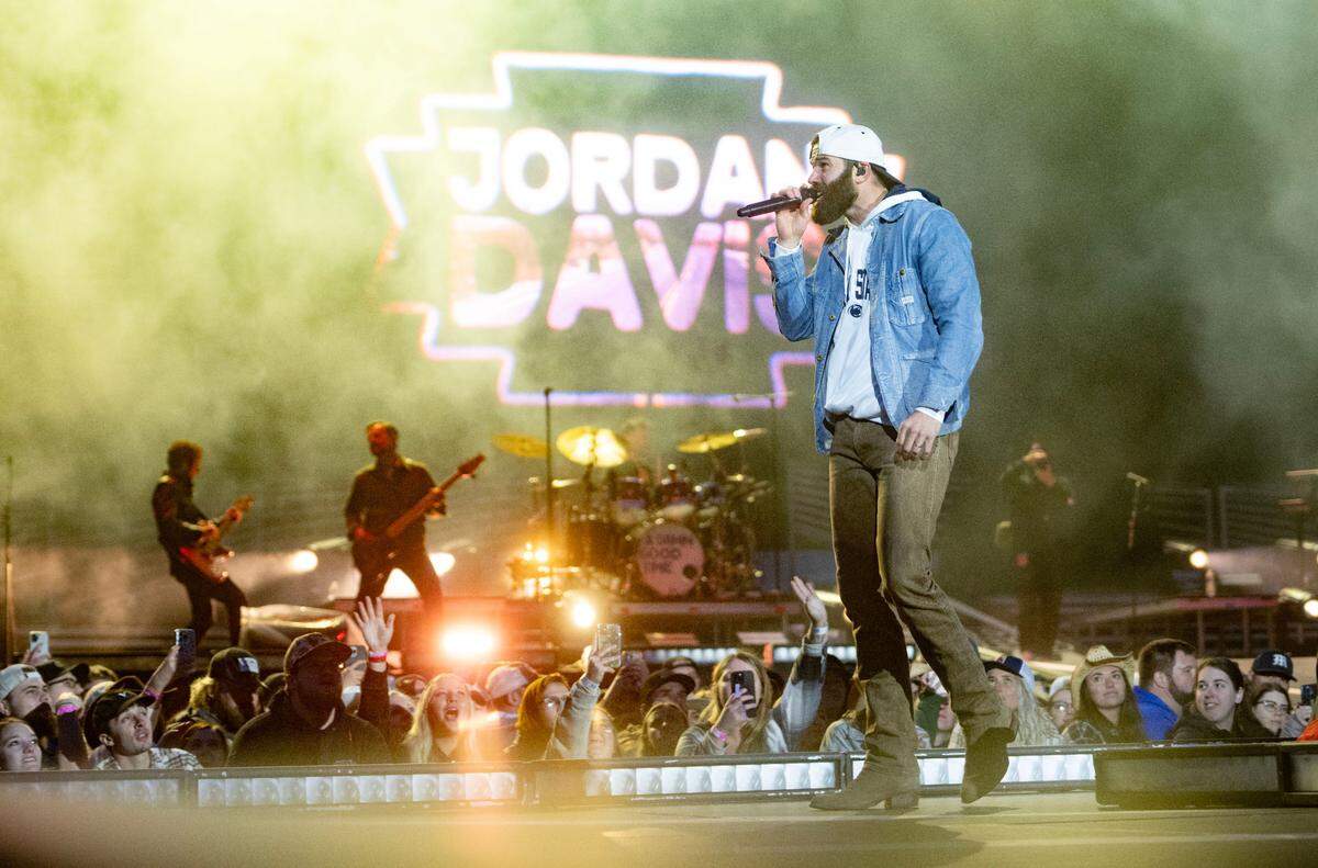 Wearing a Penn State sweatshirt Jordan Davis performs at Beaver Stadium before Luke Combs on Saturday, April 27, 2024.