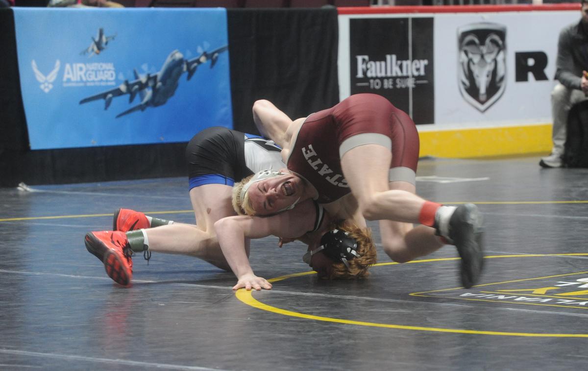 State College’s Pierson Manville looks to finish off a takedown of Central Bucks South’s Jake Neill in their 139-pound first round match of the PIAA Class 3A Championships on Thursday, March 9, 2023 at the Giant Center in Hershey. Manville pinned Neill in 1:01.